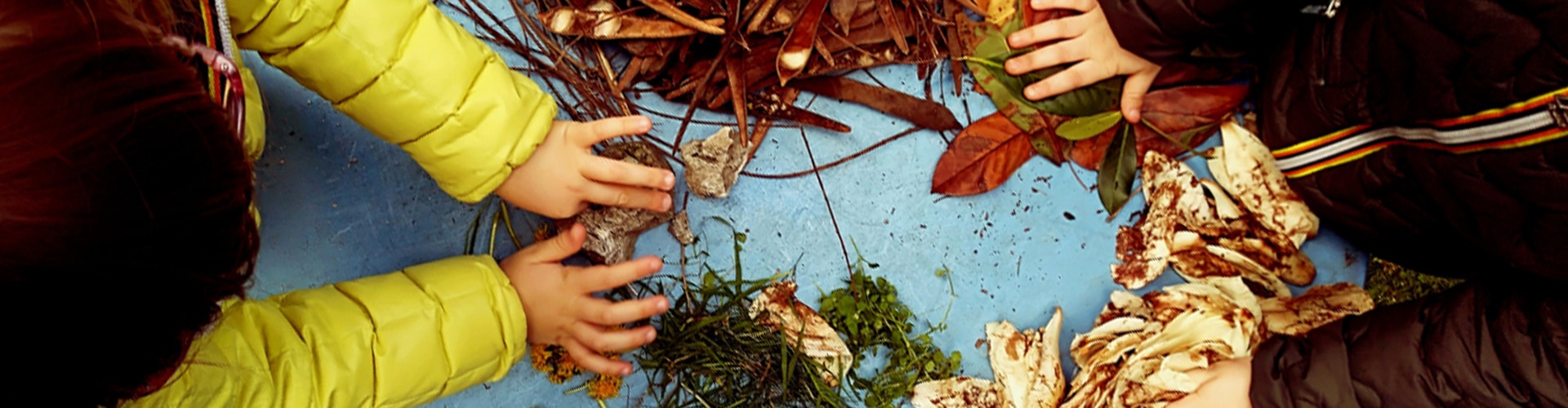 Two children taking part in outdoor maths activities