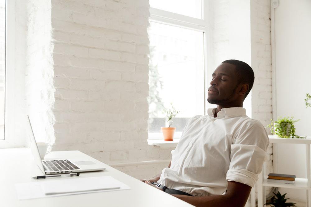 Man at laptop relaxing