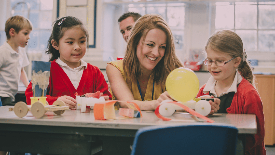 Hope Education Brand Ambassador helping pupil with experiment