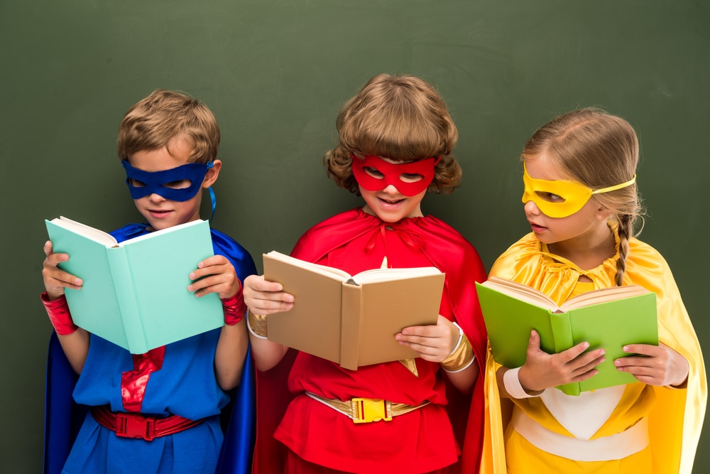 Popular costume ideas for world book day- kids dressed as superheroes with books